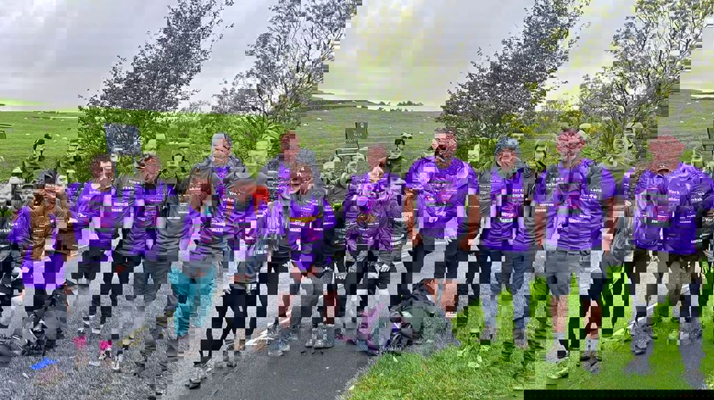 A group photo of 13 Yorkshire Housing colleagues about to take on Yorkshire 3 Peaks