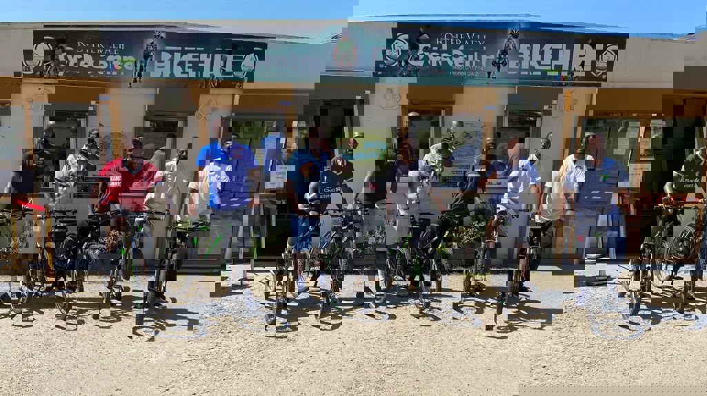 A photograph of five cyclists ready to set off on their bike ride in Somali. 