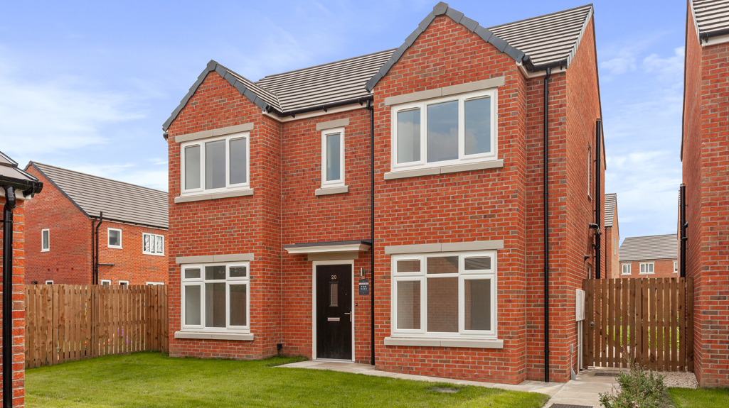 Red brick semi detached home with a lawn to the front