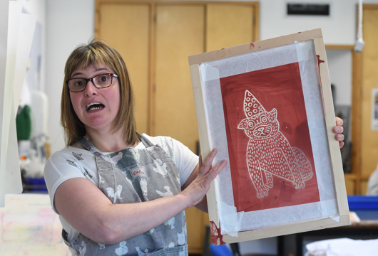 Woman holding a painting 