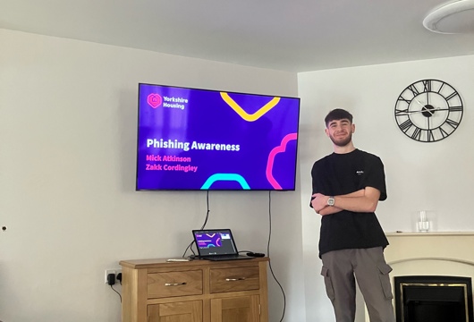Zakk Cordingley smiling ready to start his cyber security presentation
