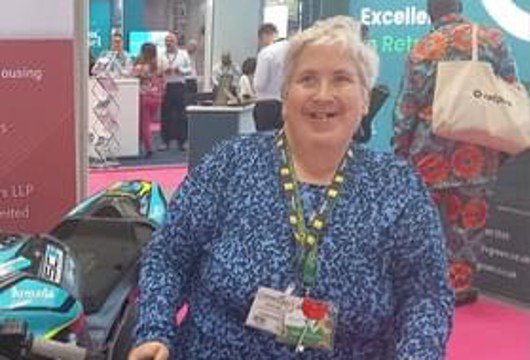 Disability Champion Mary Bottomley stood smiling at the camera 