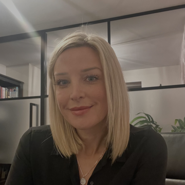 Sarah Evans in an office smiling.