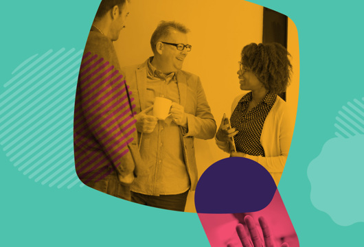 Picture of three people stood casually talking on a turquoise background