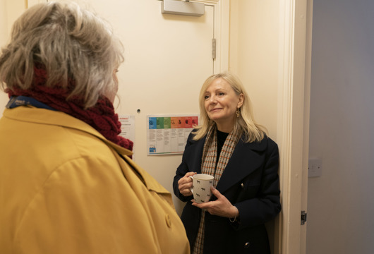 Mayor of West Yorkshire Tracy Brabin chatting to another woman who has her back to the camera