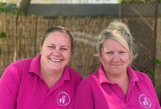 Two women smiling 