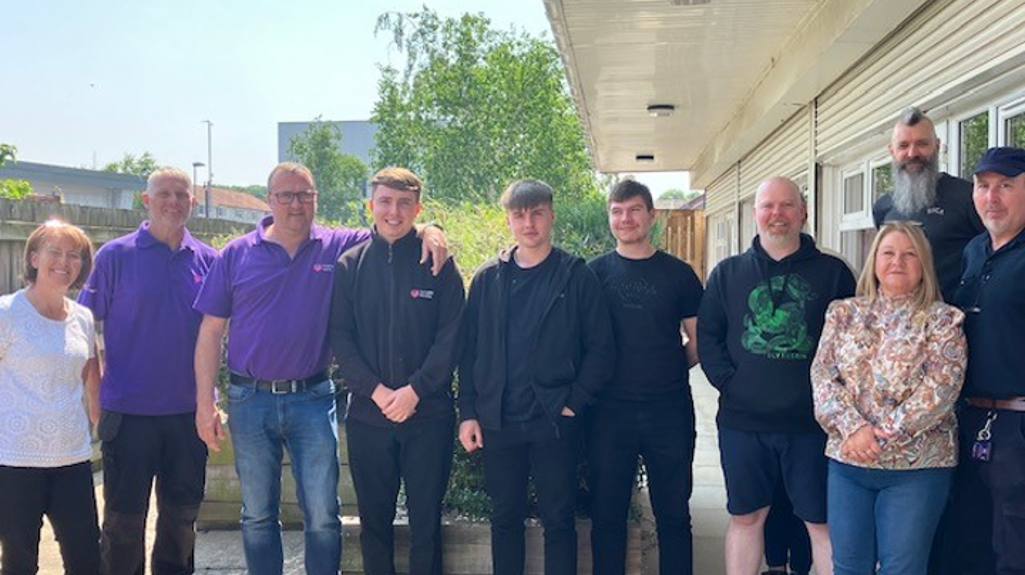 A group picture of the team at Swarcliffe stood together outside